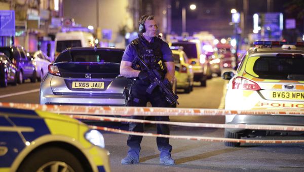 An armed police officer mans a cordon on the Seven Sisters Road at Finsbury Park where a vehicle struck pedestrians in London Monday, June 19, 2017. Police say a vehicle struck pedestrians on a road in north London, leaving several casualties and one person has been arrested. An armed police officer mans a cordon on the Seven Sisters Road at Finsbury Park where a vehicle struck pedestrians in London Monday, June 19, 2017. Police say a vehicle struck pedestrians on a road in north London, leaving several casualties and one person has been arrested. - Sputnik International