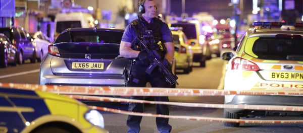 An armed police officer mans a cordon on the Seven Sisters Road at Finsbury Park where a vehicle struck pedestrians in London Monday, June 19, 2017. Police say a vehicle struck pedestrians on a road in north London, leaving several casualties and one person has been arrested. - Sputnik International