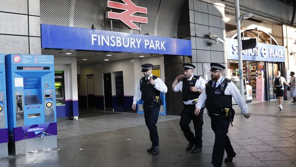 Police patrol outside Finsbury Park station in north London after a vehicle hit pedestrians, on June 19, 2017. - Sputnik International