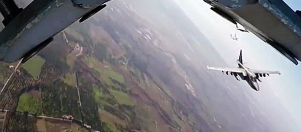 Russia's Su-25 aircraft take off from Hmeimim airbase escorted by Syria's MiG-29 fighter jets. (File) - Sputnik International