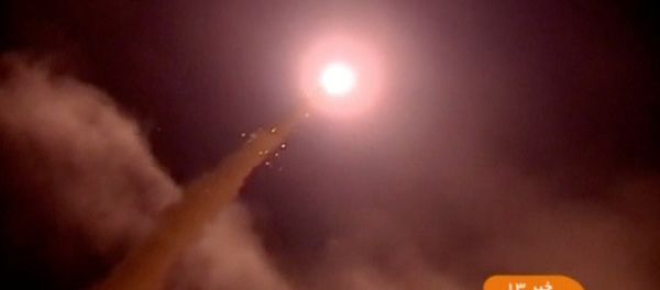 A still image taken from footage shot on June 18, 2017 and broadcast on Iranian Television IRINN, purports to show missiles being fired from Iran into eastern Syria - Sputnik International