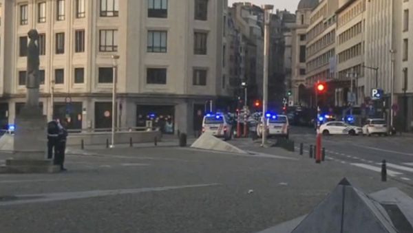 In this image taken from video, police cars create a cordon near the train station in central Brussels, Tuesday June 20, 2017. Belgian media report that explosion-like noises have been heard at a Brussels train station; the main square evacuated. - Sputnik International