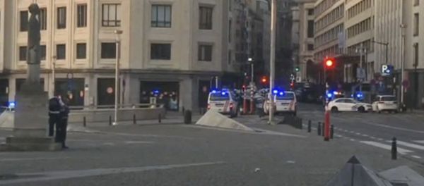 In this image taken from video, police cars create a cordon near the train station in central Brussels, Tuesday June 20, 2017. Belgian media report that explosion-like noises have been heard at a Brussels train station; the main square evacuated. - Sputnik International