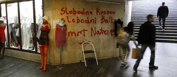 People pass through an underground passage with graffiti on the wall that reads: Free Kosovo, Free Balkan, Death for NATO, in Belgrade, Serbia (File) People pass through an underground passage with graffiti on the wall that reads: Free Kosovo, Free Balkan, Death for NATO, in Belgrade, Serbia (File) - Sputnik International