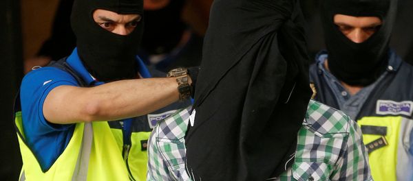 Police lead away a suspect from an apartment block during a raid in which they arrested a 32-year-old Moroccan they said was highly radicalised, in Madrid, Spain June 21, 2017 Police lead away a suspect from an apartment block during a raid in which they arrested a 32-year-old Moroccan they said was highly radicalised, in Madrid, Spain June 21, 2017 - Sputnik International
