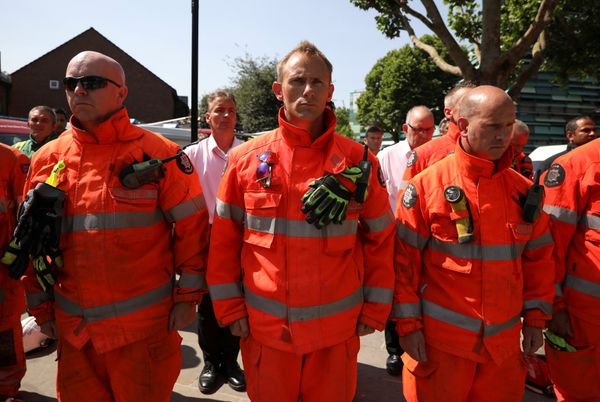 Members of the emergency services attend a minute's silence for the victims of the Grenfell Tower fire near the site of the blaze in North Kensington, London, Britain, June 19, 2017. Members of the emergency services attend a minute's silence for the victims of the Grenfell Tower fire near the site of the blaze in North Kensington, London, Britain, June 19, 2017. - Sputnik International