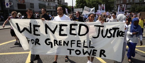 Demonstrators march during a protest about the Grenfell Tower fire, in London, Britain, June 21, 2017 Demonstrators march during a protest about the Grenfell Tower fire, in London, Britain, June 21, 2017 - Sputnik International