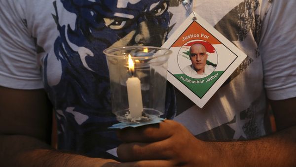 An Indian man holds a candle as he participates in a demonstration in support of Indian naval officer Kulbhushan Jadhav in Mumbai, India, Saturday, June 03, 2017 An Indian man holds a candle as he participates in a demonstration in support of Indian naval officer Kulbhushan Jadhav in Mumbai, India, Saturday, June 03, 2017 - Sputnik International