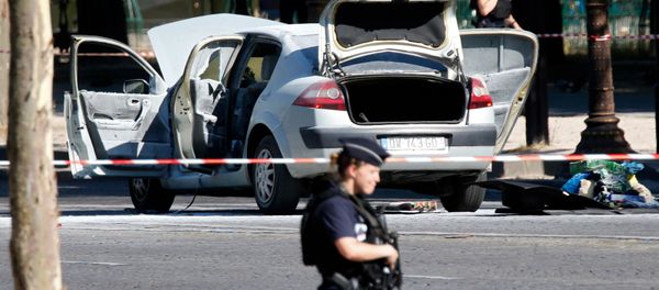 Police secure the area near a burned car at the scene of an incident in which it rammed a gendarmerie van on the Champs-Elysees Avenue in Paris, France, June 19, 2017 Police secure the area near a burned car at the scene of an incident in which it rammed a gendarmerie van on the Champs-Elysees Avenue in Paris, France, June 19, 2017 - Sputnik International