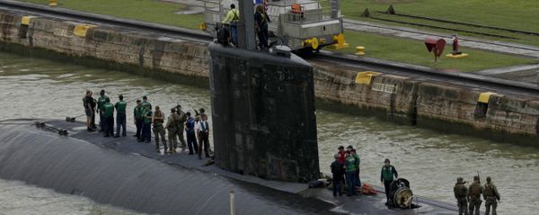 Crew members stand on top of USS Columbus (SSN-762) submarine as they sail through the Panama Canal's Miraflores Locks en route to the Pacific Ocean in Panama City, Friday, July 10, 2015 Crew members stand on top of USS Columbus (SSN-762) submarine as they sail through the Panama Canal's Miraflores Locks en route to the Pacific Ocean in Panama City, Friday, July 10, 2015 - Sputnik International