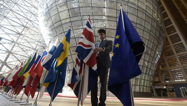 An organiser adjusts the British national flag on April 29, 2017, prior to the EU leaders summit at the Europa building, the main headquarters of European Council and the Council of the EU, in Brussels An organiser adjusts the British national flag on April 29, 2017, prior to the EU leaders summit at the Europa building, the main headquarters of European Council and the Council of the EU, in Brussels - Sputnik International