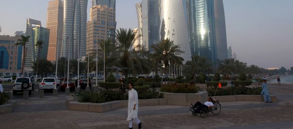 A man walks on the corniche in Doha, Qatar, June 15, 2017 - Sputnik International
