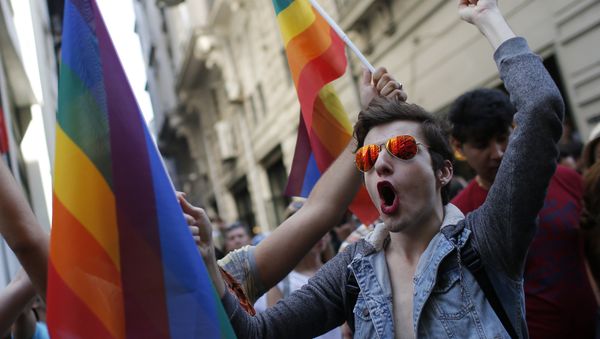 In this Sunday, June 28, 2015 file photo, participants of a Pride Week event in Istanbul, chant slogans after police used a water canon to disperse them. - Sputnik International