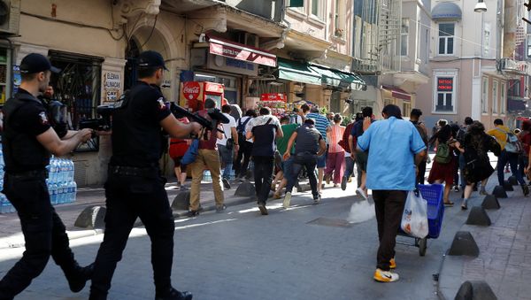 Riot police use rubber pellets to disperse LGBT rights activists as they try to gather for a pride parade, which was banned by the governorship, in central Istanbul, Turkey Riot police use rubber pellets to disperse LGBT rights activists as they try to gather for a pride parade, which was banned by the governorship, in central Istanbul, Turkey - Sputnik International