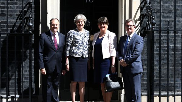 Britain's Prime Minister, Theresa May, poses for a photograph with Democratic Unionist Party (DUP) Leader Arlene Foster, Deputy Leader Nigel Dodds, and Chief Whip Jeffrey Donaldson, outside 10 Downing Street, in central London, Britain June 26, 2017. - Sputnik International