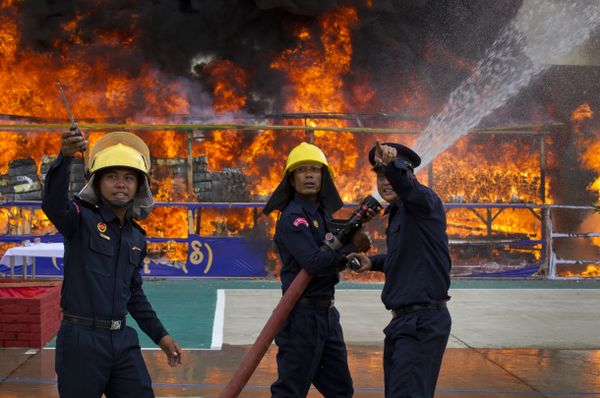 Myanmar fire fighters spray water while smokes and flames billow from burning drugs during a destruction ceremony of seized narcotic drugs in outskirts of Yangon, Myanmar, Monday, June 26, 2017. Myanmar fire fighters spray water while smokes and flames billow from burning drugs during a destruction ceremony of seized narcotic drugs in outskirts of Yangon, Myanmar, Monday, June 26, 2017. - Sputnik International