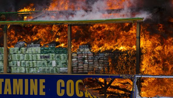 Smoke and flames billow from burning drugs during a destruction ceremony of seized narcotic drugs on the outskirts of Yangon, Myanmar, Monday, June 26, 2017. - Sputnik International