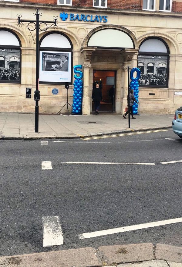 Balloons decorate the outside of the Barclays bank branch in Enfield, north London, where the world's first ATM was installed in 1967. Balloons decorate the outside of the Barclays bank branch in Enfield, north London, where the world's first ATM was installed in 1967. - Sputnik International