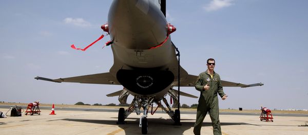 US Air Forces F-16 demonstration team pilot, Ryan Worrell from Iowa, walks past the F-16, a fighter aircraft, on display on the fourth day of the Aero India 2013 at Yelahanka air base in Bangalore, India, Saturday, Feb. 9, 2013. US Air Forces F-16 demonstration team pilot, Ryan Worrell from Iowa, walks past the F-16, a fighter aircraft, on display on the fourth day of the Aero India 2013 at Yelahanka air base in Bangalore, India, Saturday, Feb. 9, 2013. - Sputnik International