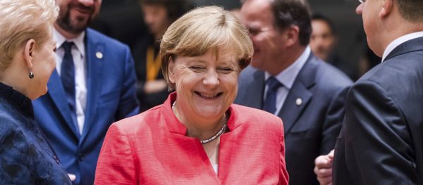 German Chancellor Angela Merkel, center, smiles as she attends a round table meeting at an EU Summit in Brussels on Friday, June 23, 2017. German Chancellor Angela Merkel, center, smiles as she attends a round table meeting at an EU Summit in Brussels on Friday, June 23, 2017. - Sputnik International