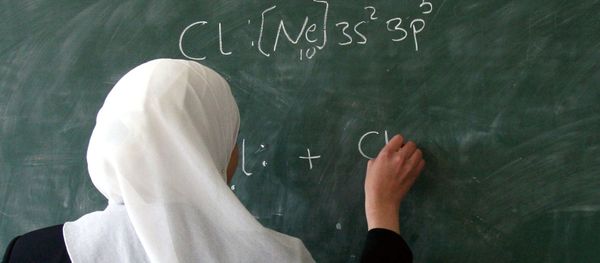 A Muslim student stands at the blackboard A Muslim student stands at the blackboard - Sputnik International
