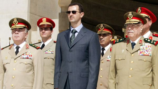 Syrian President Bashar al-Assad (C) new Defence Minister Hassan Turkmani (L) and former Defence Minister Mustafa Tlass attend a ceremony at the unknown soldier monument in Damascus, Syria October 6, 2003. Syrian President Bashar al-Assad (C) new Defence Minister Hassan Turkmani (L) and former Defence Minister Mustafa Tlass attend a ceremony at the unknown soldier monument in Damascus, Syria October 6, 2003. - Sputnik International