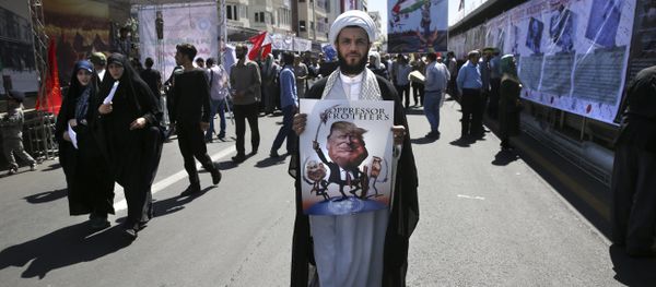 A clergyman holds a poster showing caricatures of U.S. President Donald Trump, center, Israeli Prime Minister Benjamin Netanyahu, left, and Saudi Arabia's King Salman in an annual pro-Palestinian rally marking Al-Quds (Jerusalem) Day in Tehran, Iran, Friday, June 23, 2017 A clergyman holds a poster showing caricatures of U.S. President Donald Trump, center, Israeli Prime Minister Benjamin Netanyahu, left, and Saudi Arabia's King Salman in an annual pro-Palestinian rally marking Al-Quds (Jerusalem) Day in Tehran, Iran, Friday, June 23, 2017 - Sputnik International