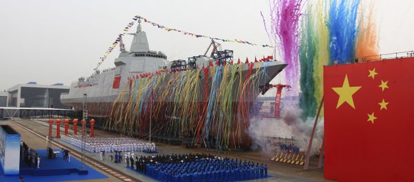In this photo released by Xinhua News Agency, fireworks explode next to China's new domestically-built 10,000-ton Type 055 destroyer during a launching ceremony at Jiangnan Shipyard in Shanghai, China, Wednesday, June 28, 2017 - Sputnik International