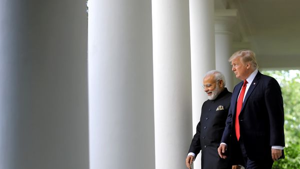 U.S. President Donald Trump (R) arrives for a joint news conference with Indian Prime Minister Narendra Modi (L) in the Rose Garden of the White House in Washington, U.S., June 26, 2017 - Sputnik International