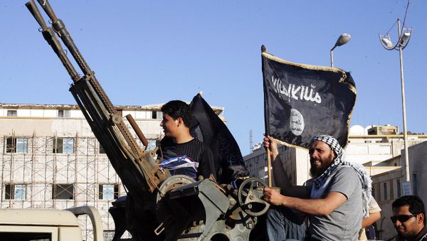 Libyan men hold Al-Qaeda flags while sitting next to an anti-aircraft artillery weapon (File) Libyan men hold Al-Qaeda flags while sitting next to an anti-aircraft artillery weapon (File) - Sputnik International