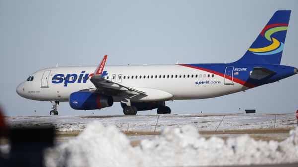 In this photograph taken late Monday, Feb. 8, 2016, a Spirit Airlines craft waits to take off from a runway at Denver International Airport. - Sputnik International