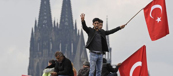 Turkish protesters demonstrate in Cologne, Germany, Sunday, July 31, 2016. Thousands of supporters of Turkish President Recep Tayyip Erdogan have gathered in the German city of Cologne for a demonstration against the failed July 15 coup in Turkey. Turkish protesters demonstrate in Cologne, Germany, Sunday, July 31, 2016. Thousands of supporters of Turkish President Recep Tayyip Erdogan have gathered in the German city of Cologne for a demonstration against the failed July 15 coup in Turkey. - Sputnik International