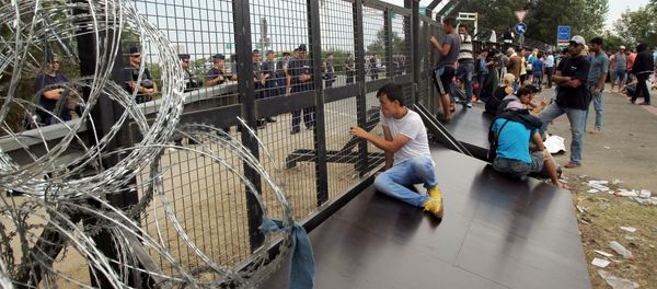 Refugees from the Middle East on the Serbian-Hungarian border. File photo - Sputnik International