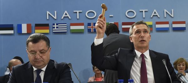 NATO Secretary-General Jens Stoltenberg (R) holds up a gavel, flanked by Ukrainian Minister of Defence and General of the Army Stepan Poltorak, during a NATO-Ukraine Defense Council meeting at the NATO Headquarters in Brussels (File) NATO Secretary-General Jens Stoltenberg (R) holds up a gavel, flanked by Ukrainian Minister of Defence and General of the Army Stepan Poltorak, during a NATO-Ukraine Defense Council meeting at the NATO Headquarters in Brussels (File) - Sputnik International