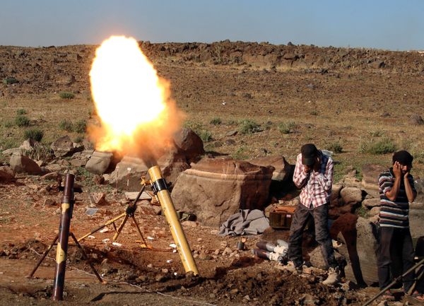 Militants fire mortar shells towards forces loyal to Syria's President Bashar al-Assad in Quneitra province, bordering the Israeli-occupied Golan Heights, Syria June 24, 2017 Militants fire mortar shells towards forces loyal to Syria's President Bashar al-Assad in Quneitra province, bordering the Israeli-occupied Golan Heights, Syria June 24, 2017 - Sputnik International