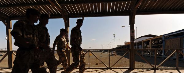 UK soldiers walk at a base in Kandahar on May 6, 2010. - Sputnik International