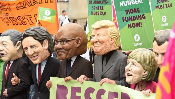 Oxfam’s Big Heads depict G20 leaders take part in protests ahead of the upcoming G20 summit in Hamburg, Germany July 2, 2017. Oxfam’s Big Heads depict G20 leaders take part in protests ahead of the upcoming G20 summit in Hamburg, Germany July 2, 2017. - Sputnik International