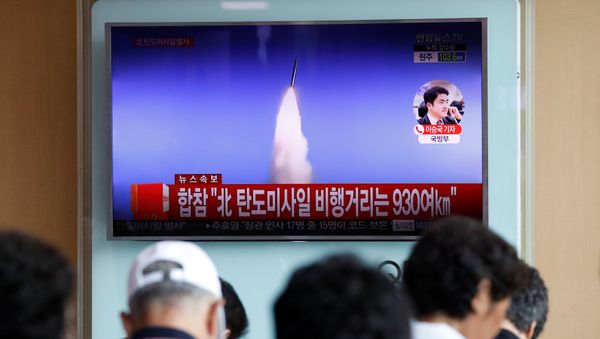 People watch a TV broadcast of a news report on North Korea's ballistic missile test, at a railway station in Seoul, South Korea, July 4, 2017. People watch a TV broadcast of a news report on North Korea's ballistic missile test, at a railway station in Seoul, South Korea, July 4, 2017. - Sputnik International