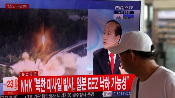 A man watches a TV broadcast of a news report on North Korea's ballistic missile test, at a railway station in Seoul, South Korea, July 4, 2017. A man watches a TV broadcast of a news report on North Korea's ballistic missile test, at a railway station in Seoul, South Korea, July 4, 2017. - Sputnik International