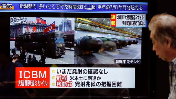 A man walks past a street monitor showing news of North Korea firing a ballistic missile in Tokyo, Japan, July 4, 2017. A man walks past a street monitor showing news of North Korea firing a ballistic missile in Tokyo, Japan, July 4, 2017. - Sputnik International