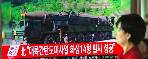 A woman walks past a television screen showing a picture of North Korea's launch of an intercontinental ballistic missile (ICBM), at a railway station in Seoul on July 4, 2017. A woman walks past a television screen showing a picture of North Korea's launch of an intercontinental ballistic missile (ICBM), at a railway station in Seoul on July 4, 2017. - Sputnik International