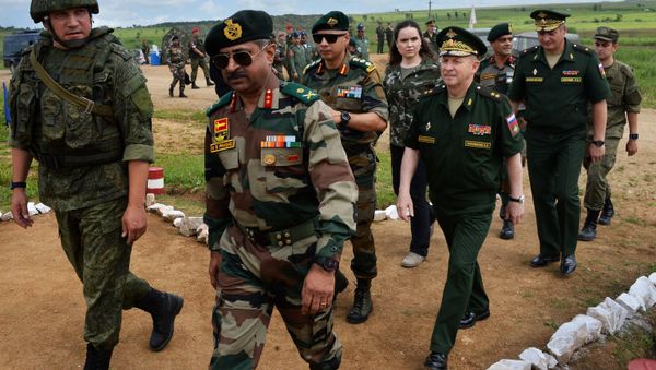 Army General of the Indian Armed Forces Durga Prasad Nudurupati (second left), Deputy Commander of the troops of the Eastern Military District Lt-Gen Sergei Solomatin (center) and Acting Commander of the 5th Combined-Arms Army Major General Roman Kutuzov (second right) visit the Sergeyevsky testing grounds in the Primorye Territory during preparations for the Indra-2017 Russian-Indian military exercises - Sputnik International