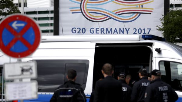 Police officers gather around the fair halls for the upcoming G-20 summit in Hamburg, Germany - Sputnik International