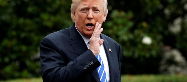 US President Donald Trump says something to reporters as he departs for travel to Poland and the upcoming G-20 summit in Germany, from the South Lawn of the White House in Washington, US, July 5, 2017. - Sputnik International