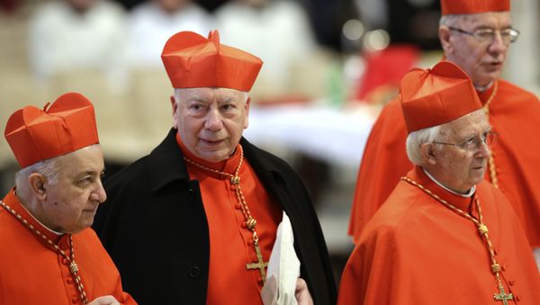 Italian Cardinal Francesco Coccopalmerio, second from left, attends a Mass for the election of a new pope celebrated by Cardinal Angelo Sodano, not pictured, inside St. Peter's Basilica, at the Vatican, Tuesday, March 12, 2013. - Sputnik International