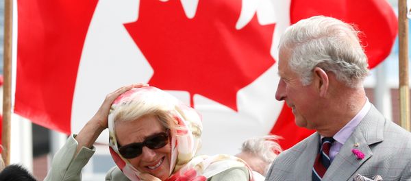 Britain's and Camilla, Duchess of Cornwall, reacts to the wind while sitting next to Prince Charles during an official welcome ceremony at the Nunavut Legislative Assembly in Iqaluit, Nunavut, Canada, June 29, 2017. - Sputnik International