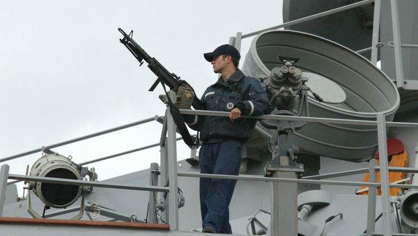 A sailor stands watch onboard the USS LaBoon as the ship sits docked in Philadelphia. (File) - Sputnik International