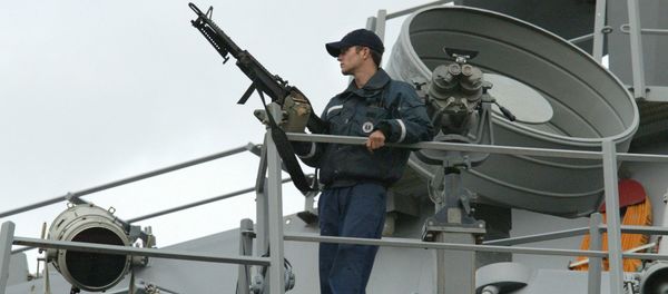 A sailor stands watch onboard the USS LaBoon as the ship sits docked in Philadelphia. (File) - Sputnik International