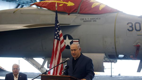 Israeli PM Netanyahu speaks as David Friedman sits next to him during a tour aboard the U.S. aircraft carrier USS George H. W. Bush, as it docks at Haifa port. July 3, 2017. - Sputnik International