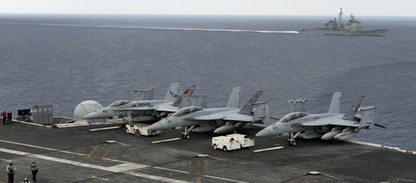 (File) The USS Normandy sails in the Bay of Bengal as U.S. Navy fighter aircrafts are stationed at the flight deck of aircraft carrier USS Theodore Roosevelt (CVN 71) during Exercise Malabar 2015, some 152 miles off eastern coast of Chennai, India, Saturday, Oct. 17, 2015 - Sputnik International